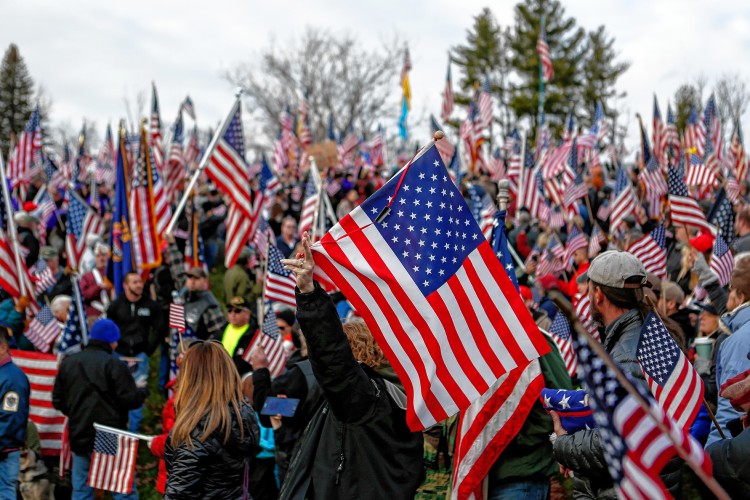 Hundreds rally at Hampshire College on Nov. 27, 2016 to protest the school's decision to hold off on hoisting the flag in the center of the Amherst campus. Hampshire College removed the U.S. flag indefinitely after, since Election Day, it has been set ablaze, replaced, and lowered to half-staff. —GAZETTE STAFF/SARAH CROSBY