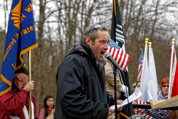 Micah Welintukonis of Coventry, Conn., who is a U.S. Army veteran, speaks Nov. 27, 2016 during a protest against Hampshire College's decision to hold off on hoisting the flag in the center of the Amherst campus. The school removed the U.S. flag indefinitely after, since Election Day, it has been set ablaze, replaced, and lowered to half-staff. —GAZETTE STAFF/SARAH CROSBY
